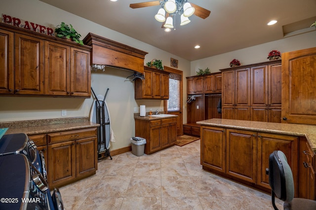 2320 Chandelle Ln, Overgaard, AZ 85933 - kitchen with a ceiling fan, brown cabinetry, and recessed lighting