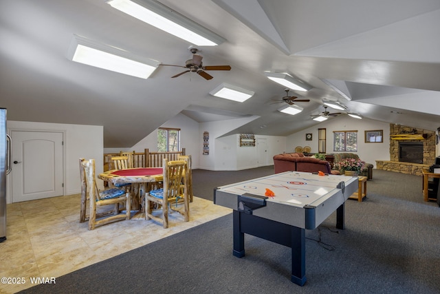 2320 Chandelle Ln, Overgaard, AZ 85933 - rec room featuring vaulted ceiling, carpet, a ceiling fan, and a skylight