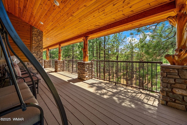 2320 Chandelle Ln, Overgaard, AZ 85933 - wooden deck with view of wooded area