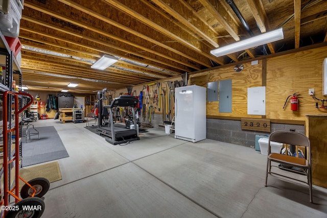2320 Chandelle Ln, Overgaard, AZ 85933 - unfinished basement with electric panel and freestanding refrigerator