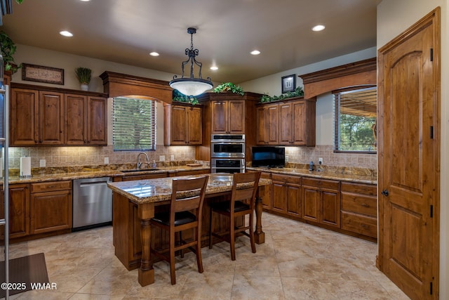 2320 Chandelle Ln, Overgaard, AZ 85933 - kitchen with appliances with stainless steel finishes, recessed lighting, healthy amount of natural light, backsplash, and stone countertops