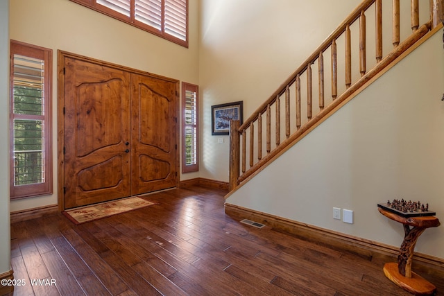 2320 Chandelle Ln, Overgaard, AZ 85933 - entryway featuring plenty of natural light, dark wood-style flooring, stairway, and a high ceiling