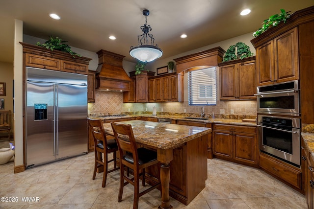 2320 Chandelle Ln, Overgaard, AZ 85933 - kitchen featuring stainless steel appliances, custom range hood, stone countertops, backsplash, and recessed lighting