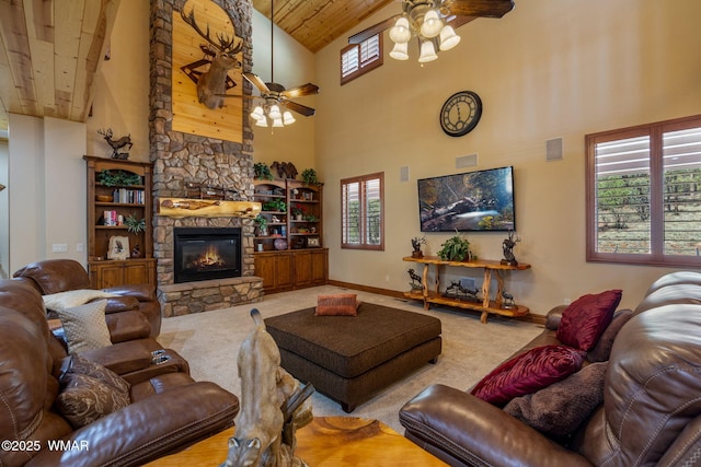 2320 Chandelle Ln, Overgaard, AZ 85933 - carpeted living area with ceiling fan, high vaulted ceiling, wooden ceiling, and a fireplace