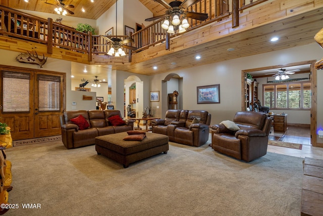 2320 Chandelle Ln, Overgaard, AZ 85933 - carpeted living room with a ceiling fan, wooden ceiling, arched walkways, recessed lighting, and a high ceiling