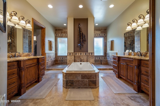 2320 Chandelle Ln, Overgaard, AZ 85933 - full bathroom with a garden tub, two vanities, and recessed lighting