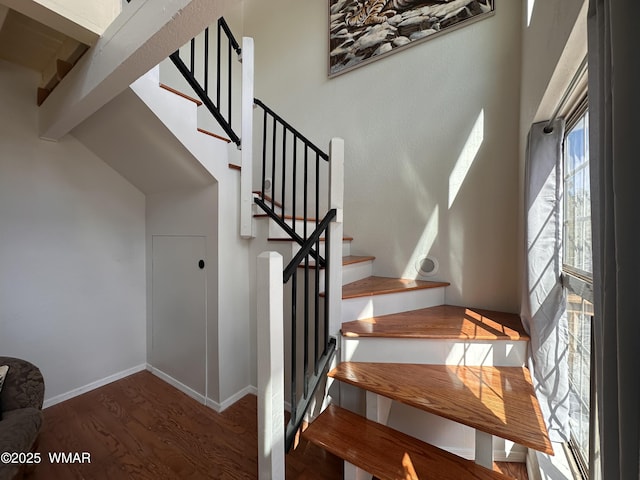 3060 Beaufeaux Ridge Rd, Overgaard, AZ 85933 - staircase featuring wood finished floors, beamed ceiling, and baseboards