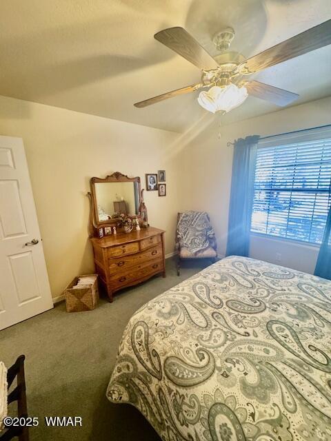 6843 Lucky Ln, Show Low, AZ 85901 - carpeted bedroom featuring ceiling fan