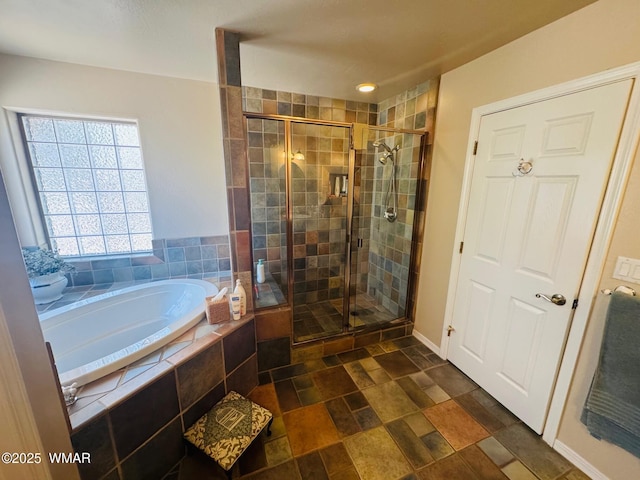 6843 Lucky Ln, Show Low, AZ 85901 - bathroom featuring a garden tub, a shower stall, and stone finish flooring