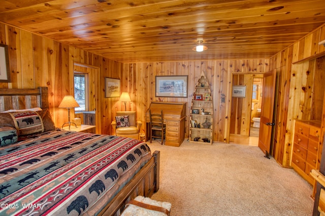 carpeted bedroom with wooden ceiling and wooden walls