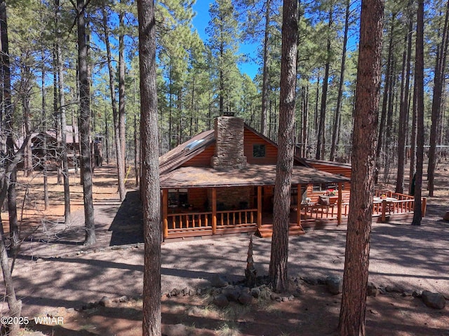 view of side of property featuring a chimney