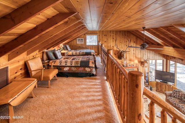 bedroom with wooden walls, vaulted ceiling, carpet floors, and wood ceiling