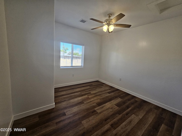 759 S 5th St W, Snowflake, AZ 85937 - unfurnished room with baseboards, dark wood-style floors, a ceiling fan, and attic access