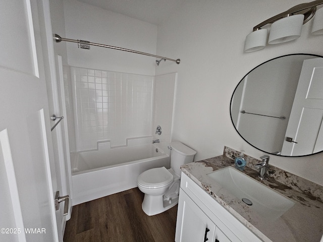 full bathroom with vanity, shower / bathtub combination, toilet, and wood finished floors