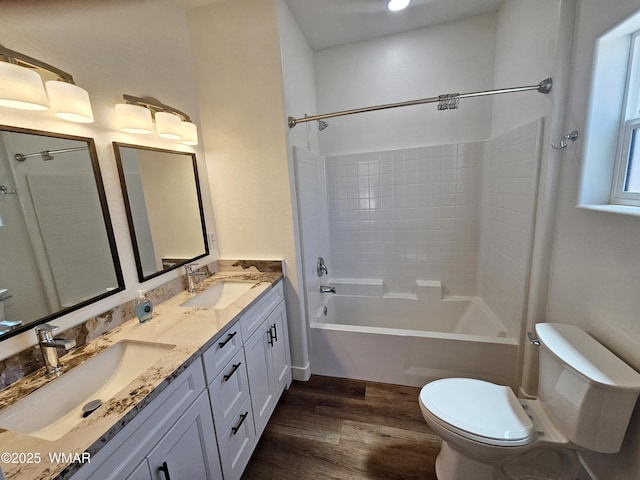759 S 5th St W, Snowflake, AZ 85937 - bathroom featuring toilet, wood finished floors, double vanity, and tub / shower combination