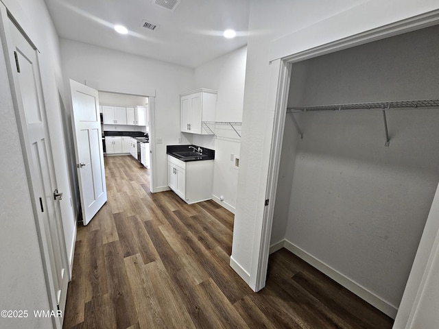 759 S 5th St W, Snowflake, AZ 85937 - hallway with a sink, dark wood finished floors, and baseboards
