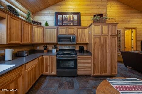 kitchen with stainless steel microwave, wooden walls, gas range, wooden ceiling, and high vaulted ceiling