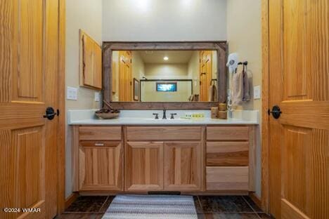 bathroom featuring vanity and a shower with door