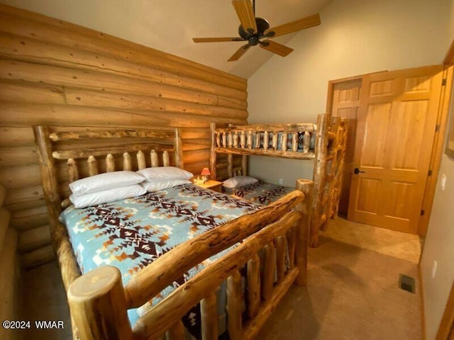 carpeted bedroom featuring rustic walls and vaulted ceiling
