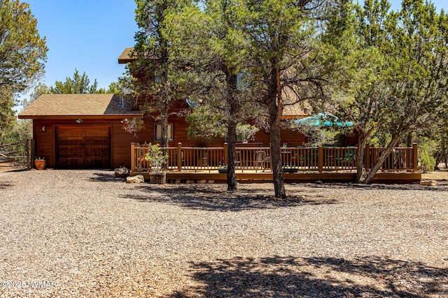 2796 Chandelle Ln, Overgaard, AZ 85933 - view of yard featuring a garage, a deck, and driveway