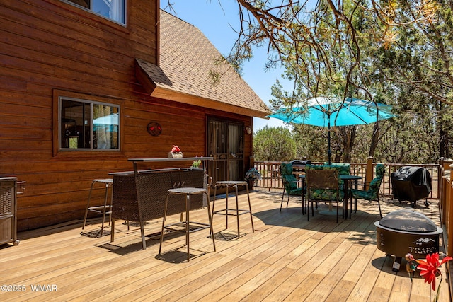 2796 Chandelle Ln, Overgaard, AZ 85933 - wooden deck featuring outdoor dining area, area for grilling, and a fire pit