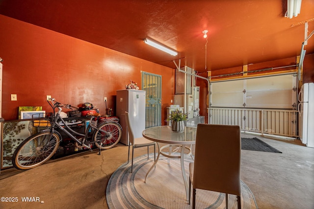 2796 Chandelle Ln, Overgaard, AZ 85933 - garage featuring freestanding refrigerator