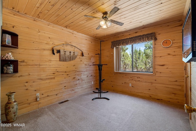 2796 Chandelle Ln, Overgaard, AZ 85933 - carpeted empty room featuring wooden walls, wood ceiling, and ceiling fan