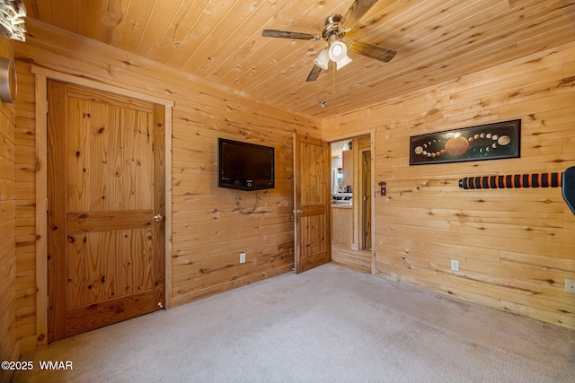 2796 Chandelle Ln, Overgaard, AZ 85933 - unfurnished room featuring carpet, wooden ceiling, ceiling fan, and wood walls