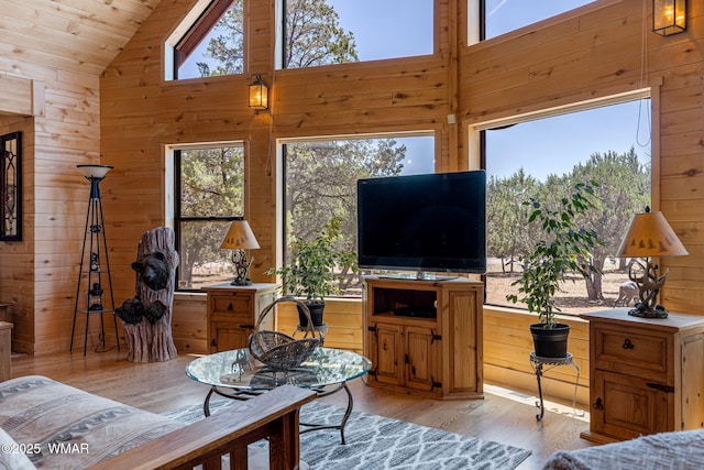 2796 Chandelle Ln, Overgaard, AZ 85933 - living area featuring wooden walls, plenty of natural light, light wood-style flooring, wood ceiling, and high vaulted ceiling