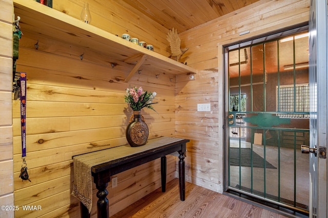 2796 Chandelle Ln, Overgaard, AZ 85933 - doorway to outside with wooden walls, wood finished floors, and wooden ceiling
