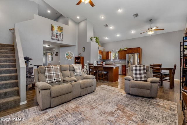 20 N Fox, Show Low, AZ 85901 - living room featuring a ceiling fan, light wood-style floors, stairway, high vaulted ceiling, and recessed lighting