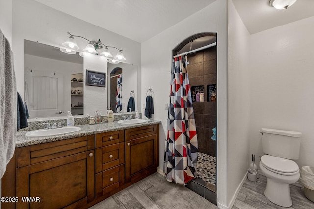 20 N Fox, Show Low, AZ 85901 - full bathroom featuring wood finished floors, tiled shower, and double vanity