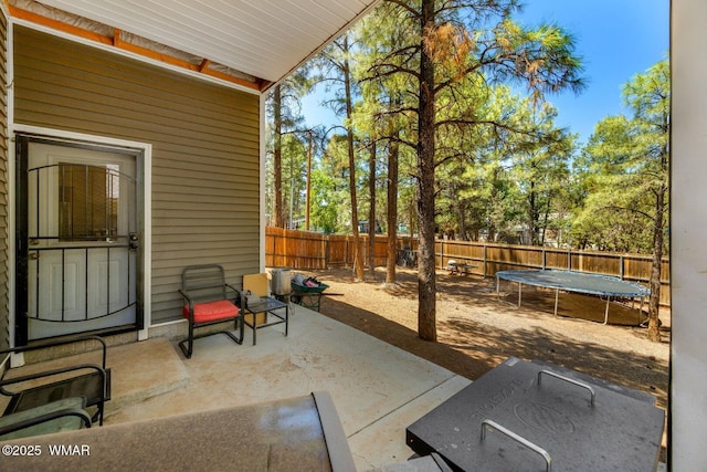 20 N Fox, Show Low, AZ 85901 - fenced backyard with a trampoline and a patio