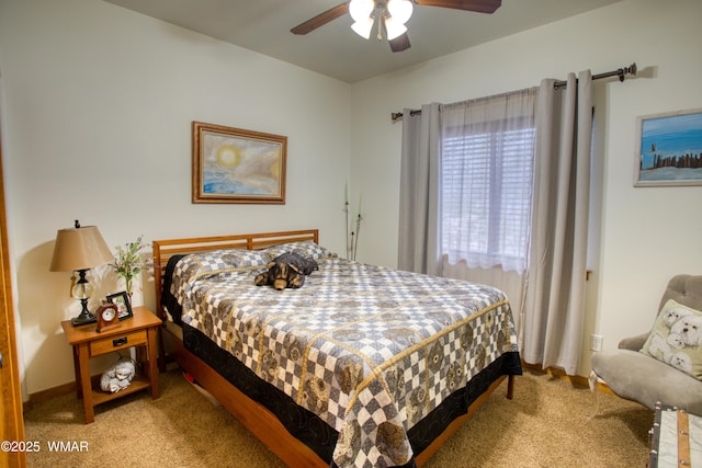 bedroom with baseboards, a ceiling fan, and light colored carpet