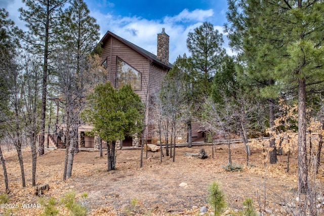 exterior space featuring a chimney