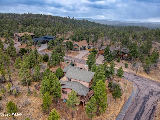 aerial view featuring a residential view and a view of trees