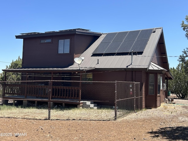 1890 Coyote Pl, Show Low, AZ 85901 - view of side of property featuring solar panels and a metal roof