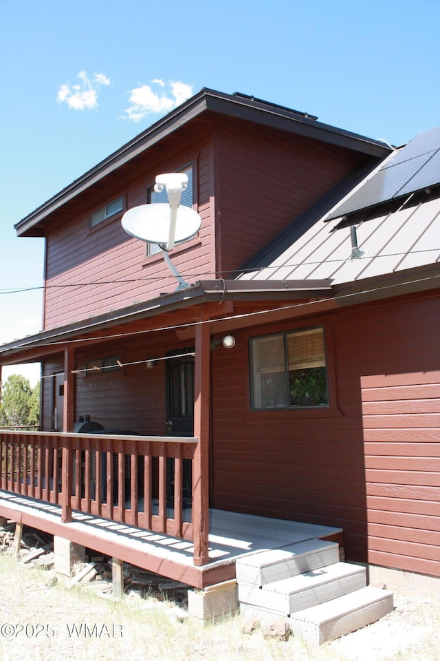 1890 Coyote Pl, Show Low, AZ 85901 - back of property featuring roof mounted solar panels and a deck