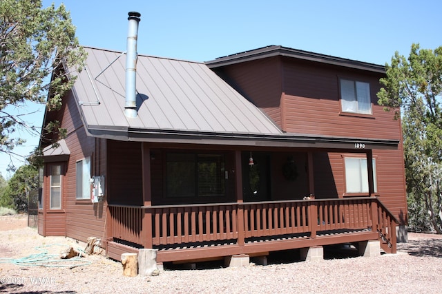1890 Coyote Pl, Show Low, AZ 85901 - back of property featuring a standing seam roof, a metal roof, and a porch