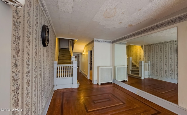 hallway with a textured ceiling