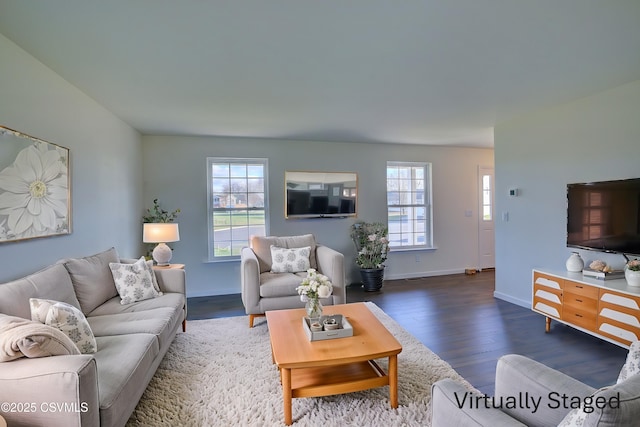 living room with baseboards and wood finished floors