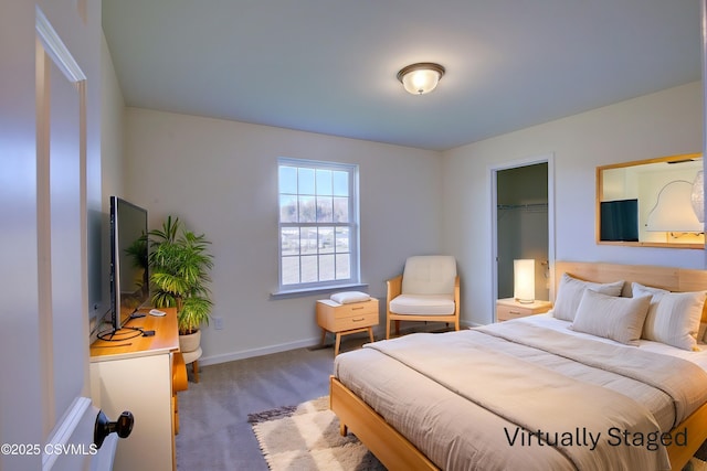 bedroom featuring carpet and baseboards