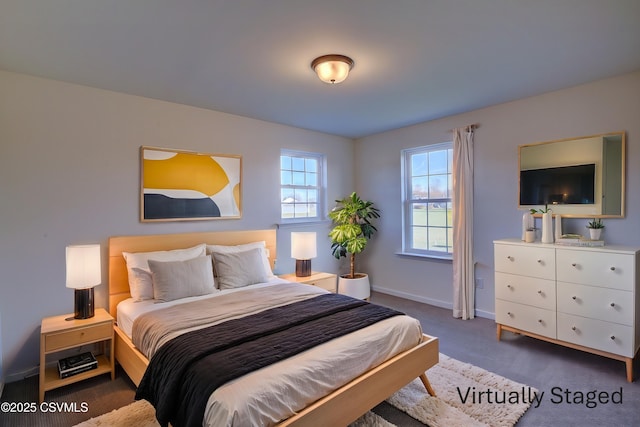 carpeted bedroom with baseboards