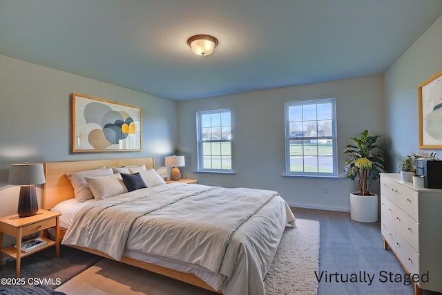 carpeted bedroom with baseboards