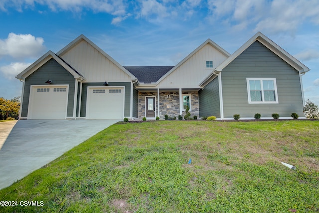 view of front facade featuring a garage and a front lawn