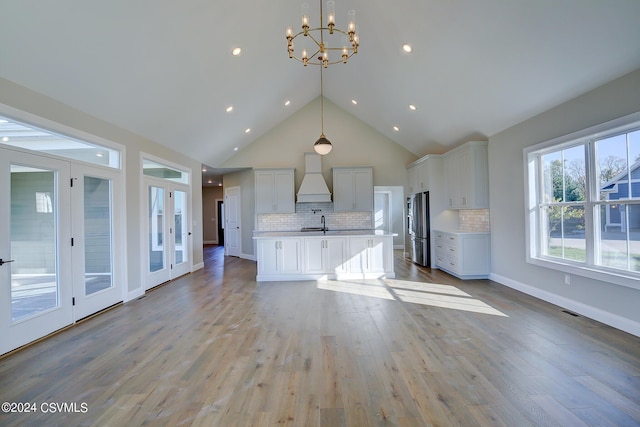 114 Windsor Way, Lewisburg, PA 17837 - unfurnished living room featuring a chandelier, high vaulted ceiling, light wood finished floors, a sink, and recessed lighting