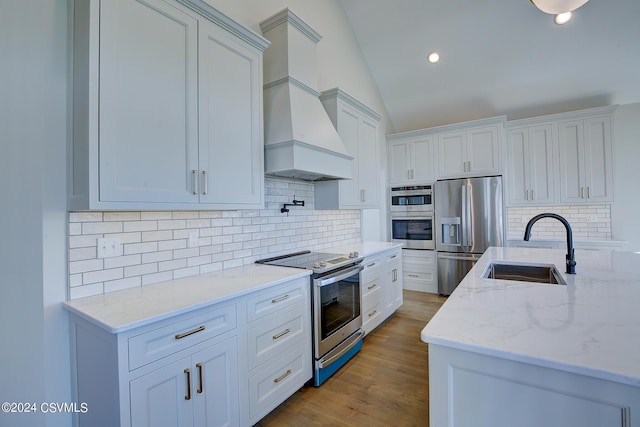 114 Windsor Way, Lewisburg, PA 17837 - kitchen featuring appliances with stainless steel finishes, a sink, custom range hood, tasteful backsplash, and white cabinets