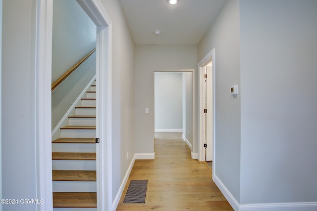 hall with light hardwood / wood-style floors