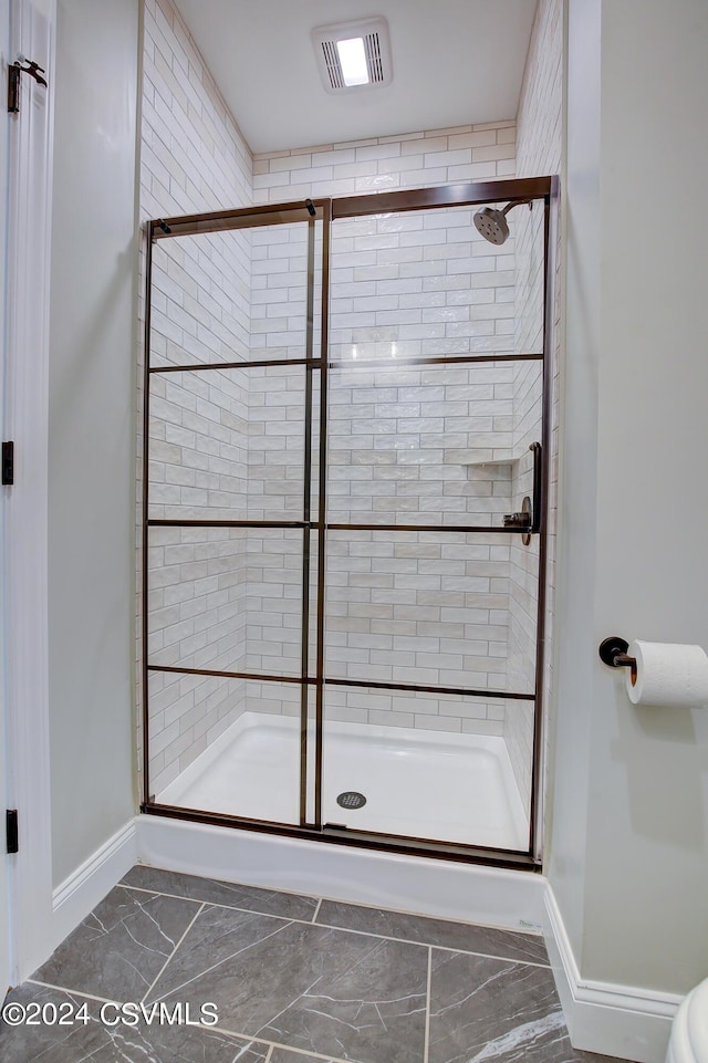 114 Windsor Way, Lewisburg, PA 17837 - bathroom featuring baseboards, a stall shower, and marble look tile flooring