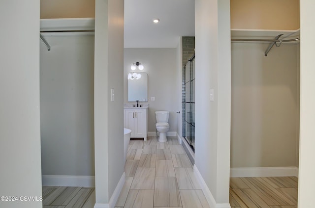 114 Windsor Way, Lewisburg, PA 17837 - bathroom with a shower stall, a walk in closet, vanity, toilet, and recessed lighting